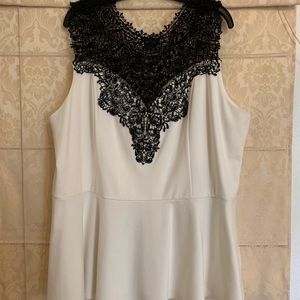 City Chic ivory peplum shirt with black lace.